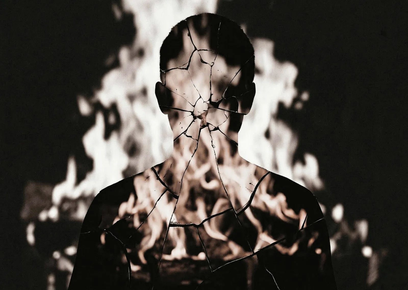 A high-contrast black and white double exposure of a human silhouette. The figure appears made of cracked, shattered porcelain. Through the jagged cracks, a roaring, blurred fire is visible, creating a sense of internal heat and psychological transformation. The image has a heavy, gritty film grain and deep charcoal tones.