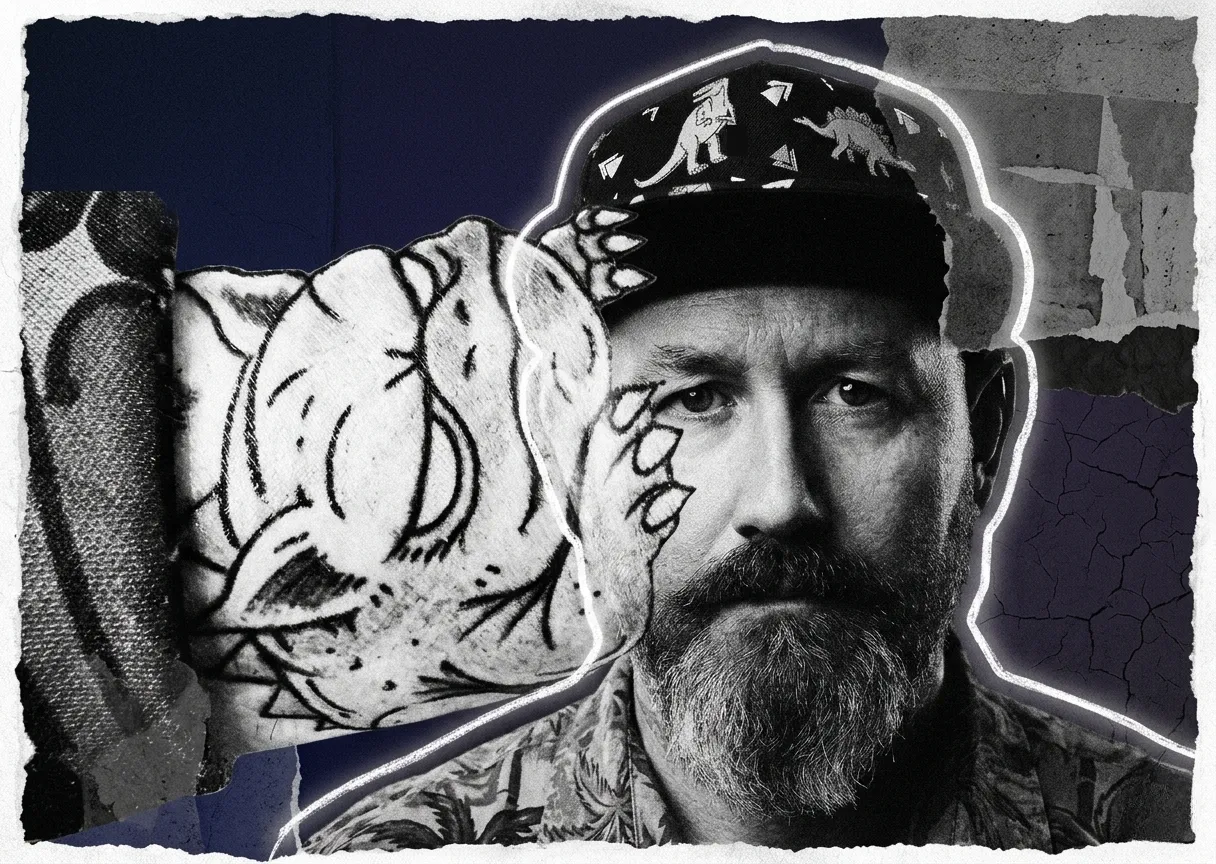 A gritty, high-contrast mixed-media collage. A black-and-white portrait of a stoic bearded man wearing a dinosaur hat is outlined by a faint glowing aura. A jagged, torn-paper rip across the left side of the image reveals a rough, textured sketch of a sleeping reptilian creature hidden underneath. The background is dark, featuring distressed textures and deep shadows.